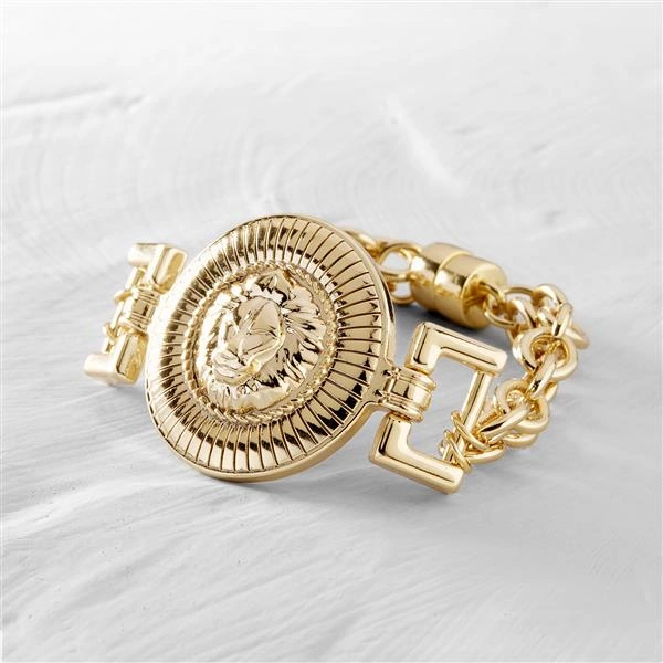 Złota bransoletka łańcuch z medalionem z głową lwa. GIANNI VERSACE
