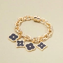 Złota bransoletka z łańcucha z czarnymi kwiatkami. LETNIA INSPIRACJA