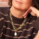 Długi pozłacany naszyjnik z hematytami i barokową perłą. COSTA BRAVA