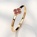 Złocona bransoletka z kwiatem w kolorze karmelu. KWITNĄCA UMBRA 