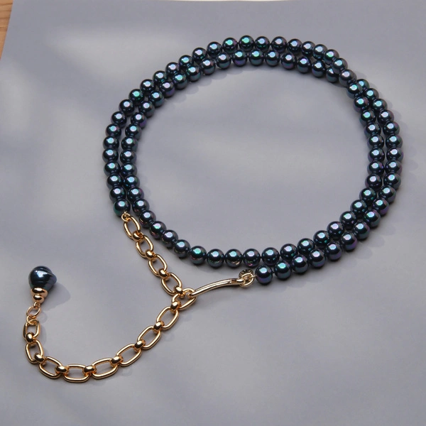 Długi złocony naszyjnik z pereł w kolorze petrol. SŁODKIE NOCE