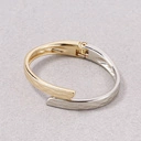 Sztywna otwarta bransoletka w kolorach srebra i złota. DWA W JEDNEJ