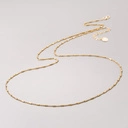 Długi złocony naszyjnik na łańcuszku z ogniw i cylindrów. ROXANNE