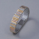 Bransoletka z inkrustowanych i pozłacanych ogniw ze stali. PHILHARMONIE