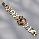 Złocona bransoleta z dekorem z czarnymi hematytami. OGNISTA GWIAZDA