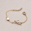 Oryginalna bransoletka z figurką akrobaty i perłą. NOWY ŚWIAT