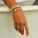 Bransoletka z inkrustowanych i pozłacanych ogniw ze stali. PHILHARMONIE