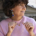 Pozłacany naszyjnik na łańcuszku z małymi krzyżami. PUNKOWY