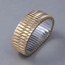 Pozłacana elastyczna bransoletka z ogniw ze stali. CHAMP ELYSSES