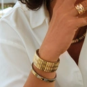 Bransoletka z inkrustowanych i pozłacanych ogniw ze stali. RUE SAINT HONORE