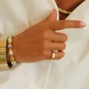 Bransoletka z inkrustowanych i pozłacanych ogniw ze stali. PHILHARMONIE