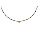 Naszyjnik z czarnych i złoconych koralików z gwiazdką. LA ESTRELLA DEL LEON
