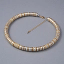 Krótki naszyjnik z pozłacanymi i posrebrzanymi krążkami. GRANDE ROUE