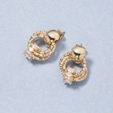 Nietypowe, pozłacane kolczyki ozdobione cyrkoniami. CHARLESTON