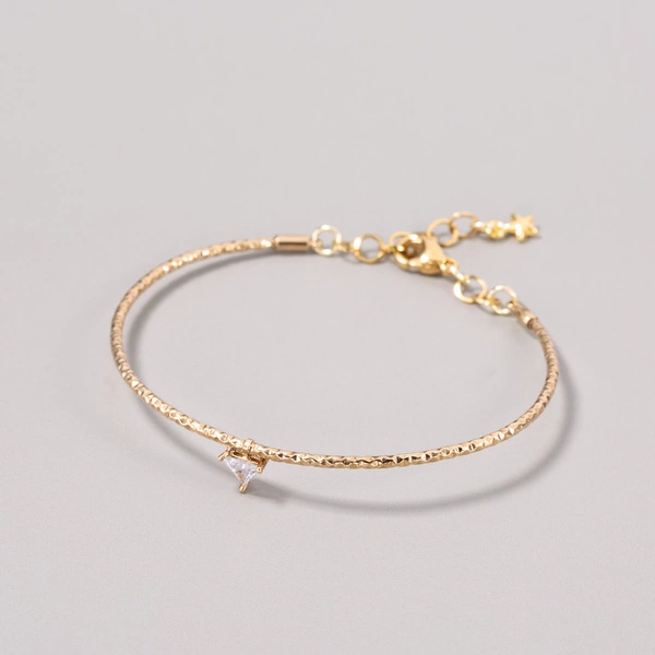 Pozłacana bransoletka z trójkątnym krysztakiem. ŚWIATŁO W ZENICIE