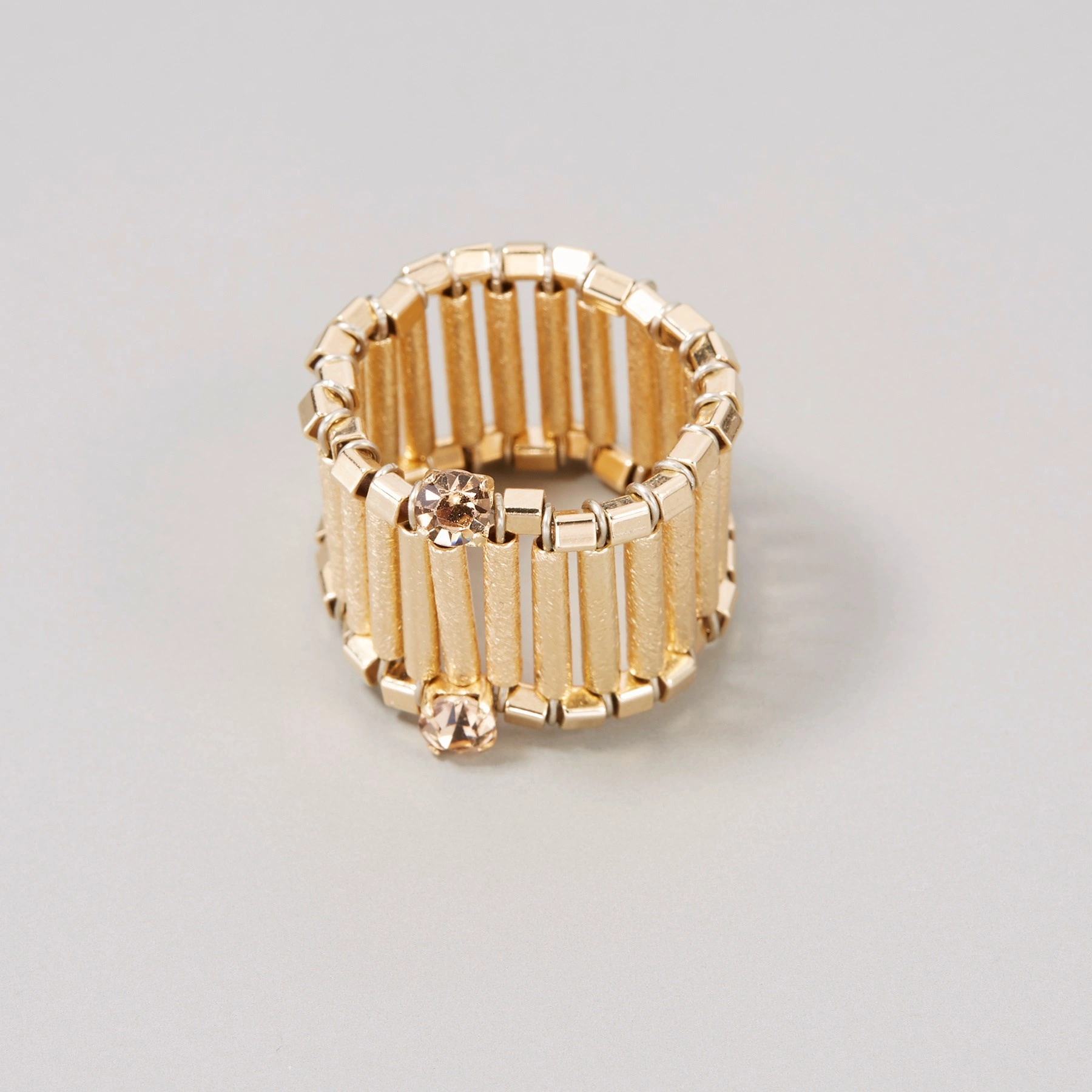 Pierscionek obrączka na gumce z pozłacanych rurek. PAROLES PAROLES