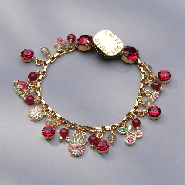 Złocona bransoletka z jadeitami i zawieszkami z kryształków. OWOCE LEŚNE