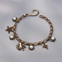 Krótki złocony naszyjnik z perłami i morskimi motywami. SKARBY OCEANU