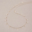 Pozłacany naszyjnik na łańcuszku z małymi krzyżami. PUNKOWY