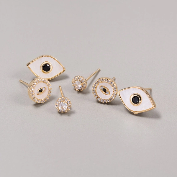 Zestaw trzech pozłacanych kolczyków z motywem oczu. ZMYSŁOWE OCZY
