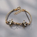 Sztywna złocona bransoletka z perłami i szarymi kryształami. DWA KSIĘŻYCE