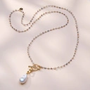 Długi złocony naszyjnik na lince z barokową perłą. SANT PERE PESCADOR