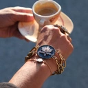 Pozłacana bransoletka z motywem kwiatka z cyrkonii. ŚRODEK LATA