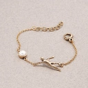 Oryginalna bransoletka z figurką akrobaty i perłą. NOWY ŚWIAT