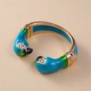 Złocona bransoletka z dwiema głowami papug z cyrkoniami. NIEROZŁĄCZKI