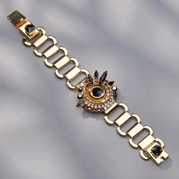 Złocona bransoleta z dekorem z czarnymi hematytami. OGNISTA GWIAZDA