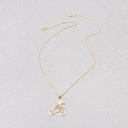 Złoty naszyjnik z zawieszką z dziewczynką na rowerze. NA SZOSĘ