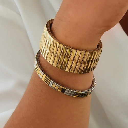 Bransoletka z inkrustowanych i pozłacanych ogniw ze stali. RUE SAINT HONORE