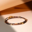 Bransoletka z motywem skóry węża z pozłacanymi sercami. SIĘGAM PO MARZENIA