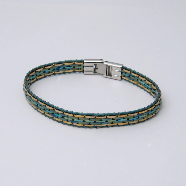 Elastyczna bransoletka ze złotych i niebieskich ogniw. PRZYLĄDEK NADZIEI