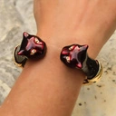 Złocona bransoletka z panterami w kolorze cabernet. SERENA