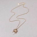 Wisiorek z cytrynem i koralikami z masy perłowej. AROMAT CARURU