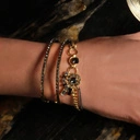 Złocona bransoletka z oczkiem z kryształami na łańcuszku. DRAPACZE CHMUR