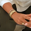 Bransoletka z inkrustowanych i pozłacanych ogniw ze stali. RUE SAINT HONORE