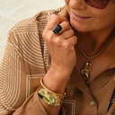 Krótki pozłacany naszyjnik z zawieszką z jaguarem. ODGŁOS AMAZONII