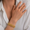 Wąska sztywna pozłacana bransoletka z ażurowym wzorem. PRZEŚWITY SŁOŃCA