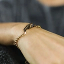 Bransoletka na łańcuszku z kolibrem i małym szafirem. SYMBOL SŁOŃCA