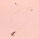 Krótki srebrno-złoty wisiorek z klatką z ptaszkiem. FRASZKA