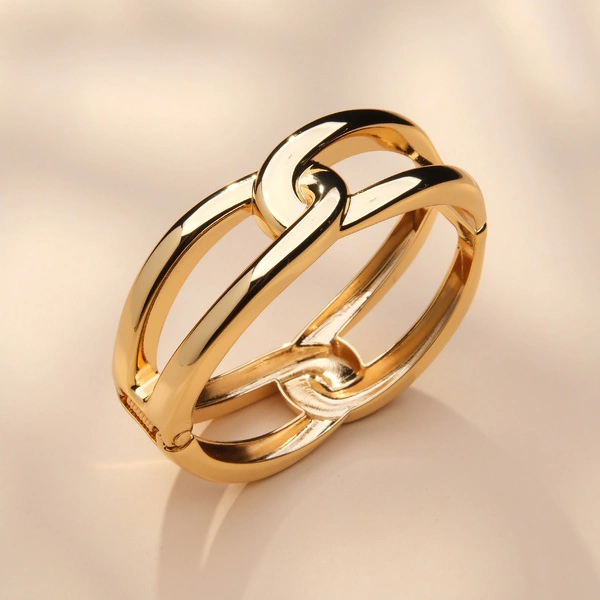 Sztywna bransoletka ze złoconych grubych ogniw. SPLOT ŚWIATŁA