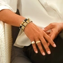 Bransoletka z inkrustowanych i pozłacanych ogniw ze stali. CITE PICASSO