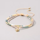 Bransoletka z paciorków Miyuki z zawieszką w formie kwiatka. MARIE