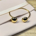 Sztywna pozłacana bransoletka z dwiema półkulami. DWIE POŁÓWKI