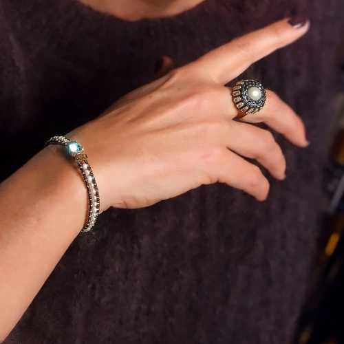 Złocona bransoletka z perłami i przezroczystym kryształem. ENERGIA MIASTA