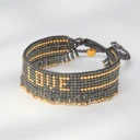 Bransoletka z szarych paciorków Miyuki ze złotym napisem. SŁOŃCE MÓWI LOVE