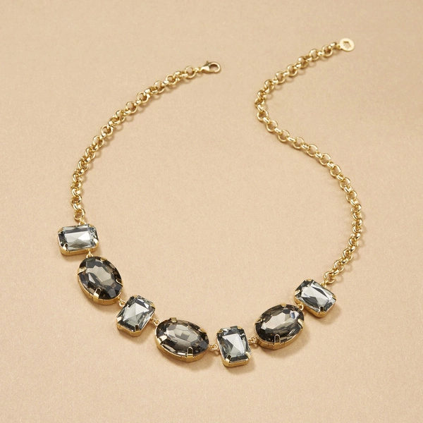 Krótki pozłacany naszyjnik z szarymi kryształami. MARTINI