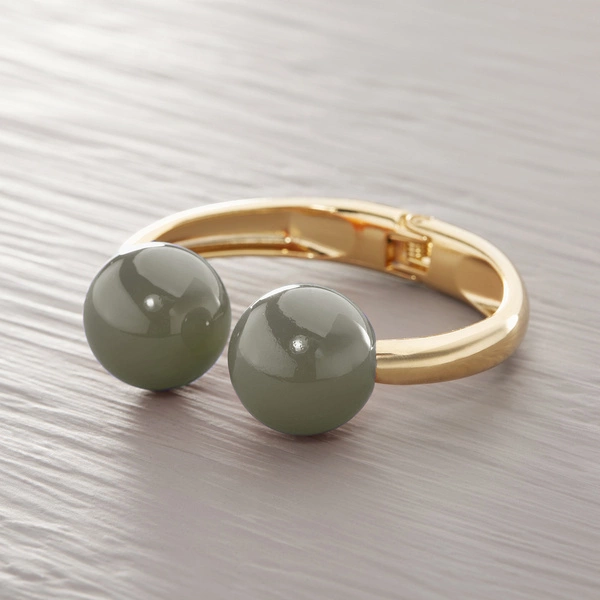 Sztywna złota bransoletka z dwiema kulami khaki. KHAKI NA CIEPŁO